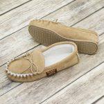 Handmade Sahara Sheepskin Moccasin Slippers on wooden background