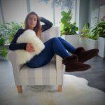 Sheepskin Cushion Cover, female model holding Ivory cushion