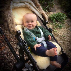 Baby Sheepskin Pushchair Liner with baby in pushchair