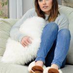 Luxury Ivory sheepskin cushion cover held by female from sheepland