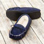 Navy British Made Suede Moccasin Slippers on brown background