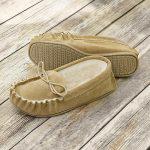 Beige British Made Suede Moccasin Slippers on wooden floor boards