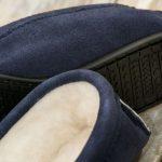 Navy British Made Suede Moccasin Slippers on wooden background