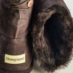Chocolate sheepskin slipper boots, close up of the sheepskin collar and heel detail
