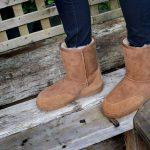 Tan Slim fit outdoor sheepskin boots, wooden background