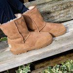 Slim fit sheepskin boots, on wooden bench