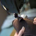 British made mocha house boots being stitched on a machine