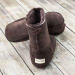 British made mocha house boots on a wooden background, sheepland logo