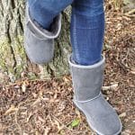Grey Sheepskin Boots by a tree